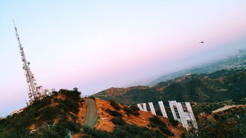 Low angle view of communications tower on mountain