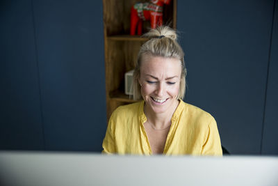 Smiling woman in office