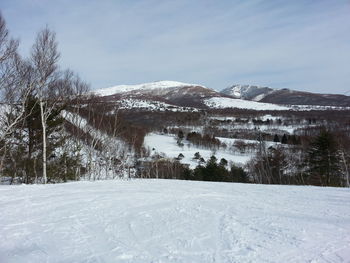 Scenic view of snow covered mountains
