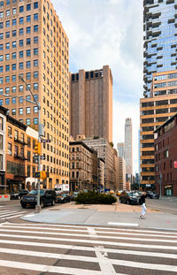 Modern buildings in city against sky new york city cityscape streetscape with zebra crossing