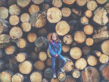 Portrait of girl standing no logs