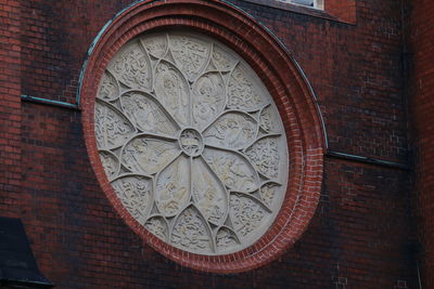 Low angle view of brick wall in building