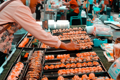 Man preparing food on barbecue grill