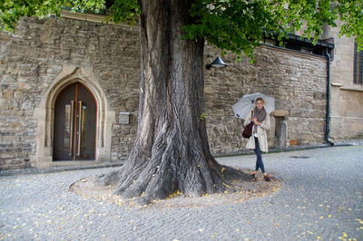 Woman in front of building