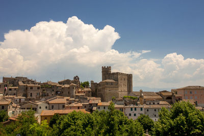 Buildings in city against sky