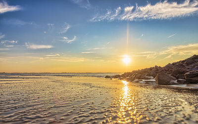 Scenic view of calm sea at sunset