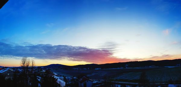 Scenic view of landscape against sky during sunset