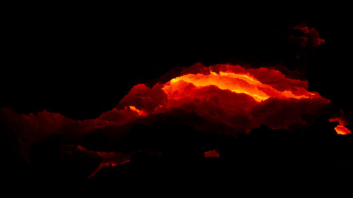 View of illuminated bonfire against sky at night