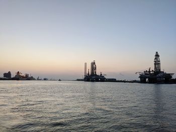 Scenic view of sea against clear sky during sunset