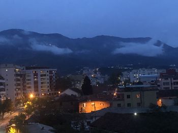 High angle view of illuminated buildings in city at night
