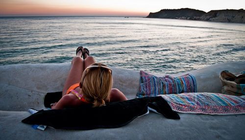 Two people relaxing on beach