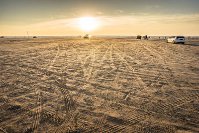 Scenic view of beach against sky during sunset