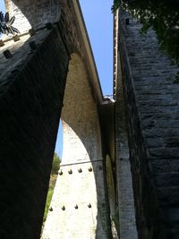 Low angle view of bridge against building