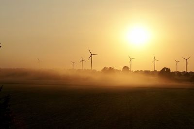 Scenic view of field against sky during sunset