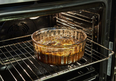 Cauliflower souffle in a transparent bowl in the oven after baking