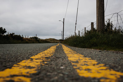 Surface level of road against sky