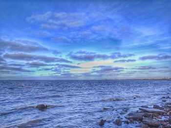 Scenic view of sea against cloudy sky