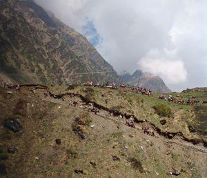 Scenic view of mountain against cloudy sky