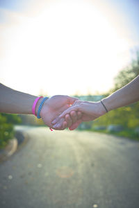 Cropped hand of woman holding water