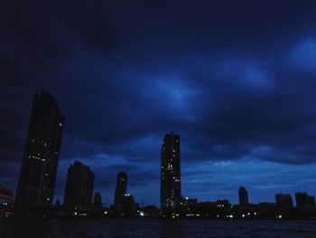 Low angle view of skyscrapers lit up at night