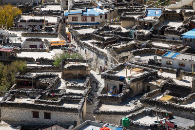 High angle view of crowd on street amidst buildings in city