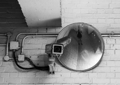 Close-up of electric fan on wall