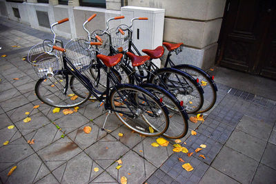 High angle view of bicycle parked on footpath