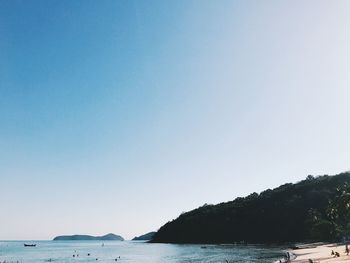 Scenic view of sea against clear blue sky