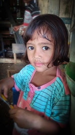 Portrait of girl holding camera