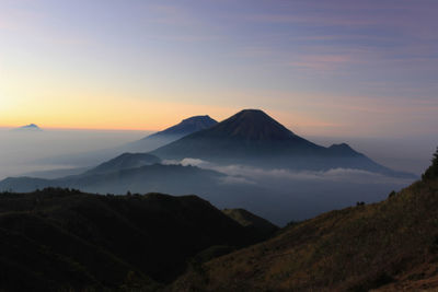 Scenic view of mountains against sky during sunset