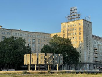 The sun reflects on the buildings