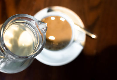Milk being poured in coffee
