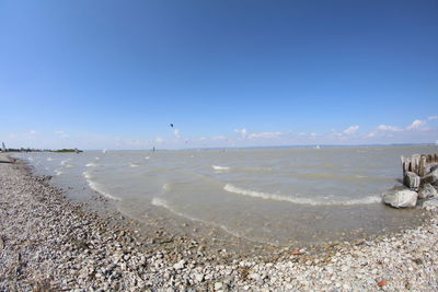 Scenic view of beach against clear sky