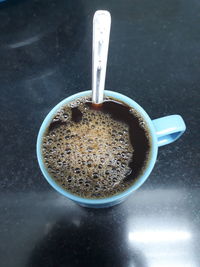 High angle view of coffee cup on table