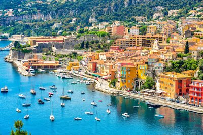 Panoramic view of beautiful luxury resort and bay on hills leading down to coast of french riviera.