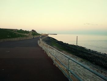 Scenic view of sea against clear sky during sunset