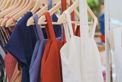 Clothes hanging on rack in store