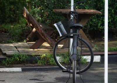 Old bicycle wheel on footpath