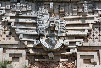 Sculpture of statues outside building