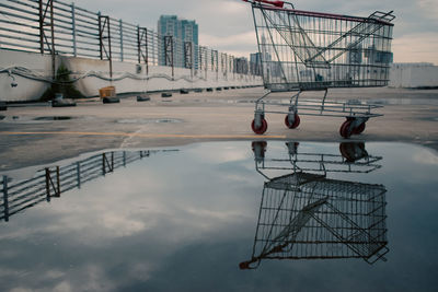 High angle view of shopping carts against blue sky