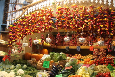 Various vegetables arranged for sale at market stall