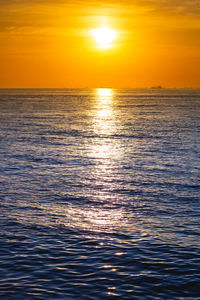 Scenic view of sea against romantic sky at sunset