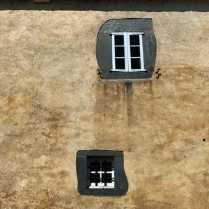 Low angle view of window on wall of building