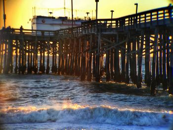 Waves in sea at sunset