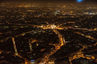 High angle view of illuminated modern buildings in city at night