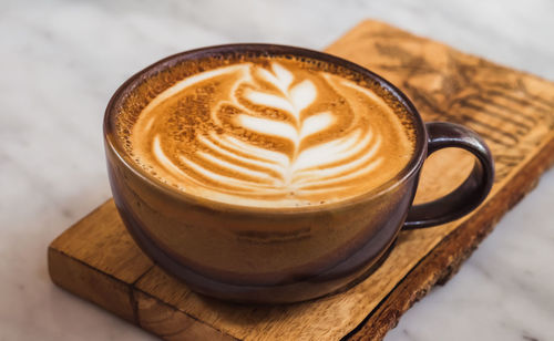 Close-up of cappuccino on table