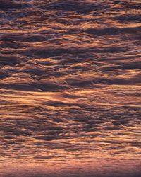 Full frame shot of dramatic sea during sunset. upside down