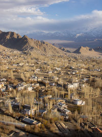 High angle view of buildings in city against sky