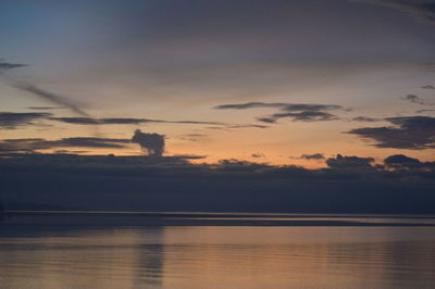 Scenic view of lake against sky during sunset