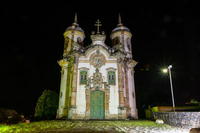 Low angle view of illuminated building at night